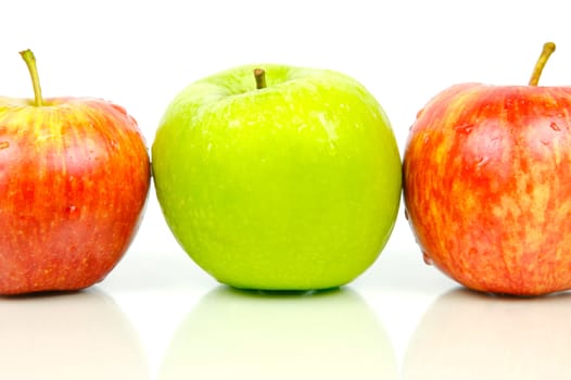 Red and green apples isolated against a white background