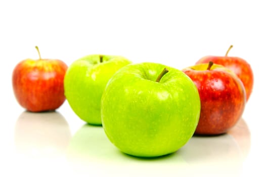 Red and green apples isolated against a white background