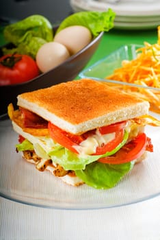 fresh and delicious classic club sandwich over a transparent glass dish