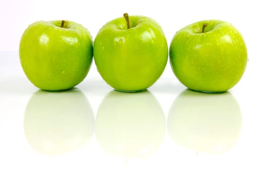 Green apples isolated against a white background