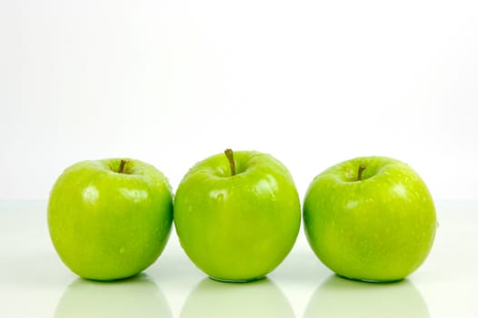 Green apples isolated against a white background