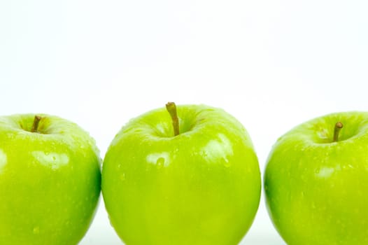 Green apples isolated against a white background