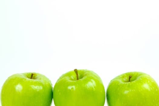 Green apples isolated against a white background