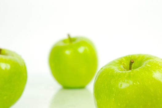 Green apples isolated against a white background