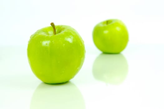 Green apples isolated against a white background