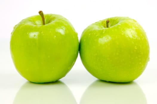 Green apples isolated against a white background