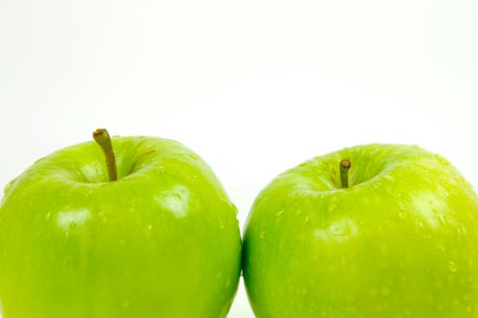 Green apples isolated against a white background