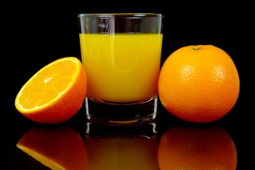 Orange juice isolated against a black background