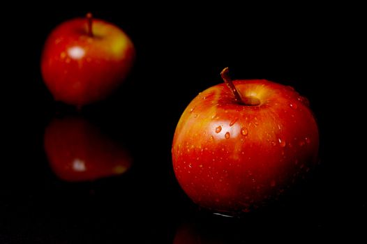 Red Apples isolated against a black background