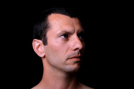young man over black background