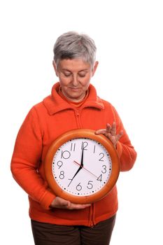 mature woman with clock over white background