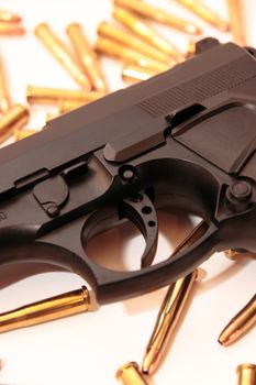 gold ammo and a handgun depicting gun culture