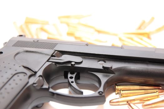 gold ammo and a handgun depicting gun culture