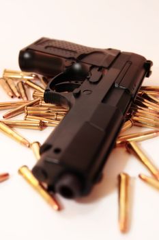 gold ammo and a handgun depicting gun culture