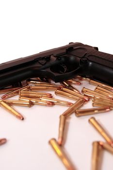 gold ammo and a handgun depicting gun culture