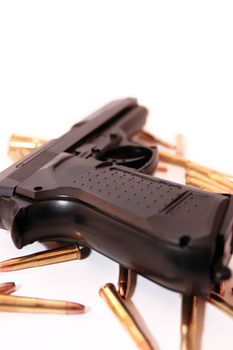 gold ammo and a handgun depicting gun culture