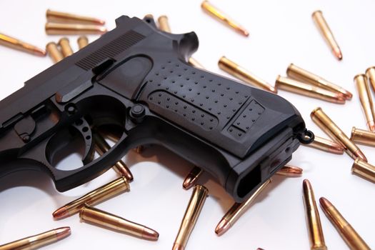 gold ammo and a handgun depicting gun culture