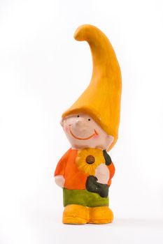 Little statuette of a gnome boy in yellow cap