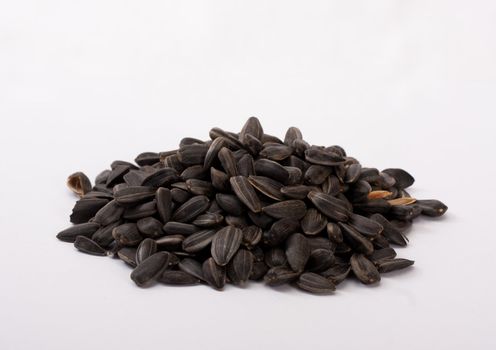 A handful of sunflower's seeds on a white isolated background