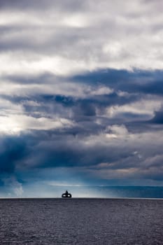 ferry boat with storm clounds