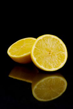 Lemon citrus fruits isolated against a black background