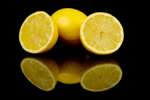 Lemon citrus fruits isolated against a black background