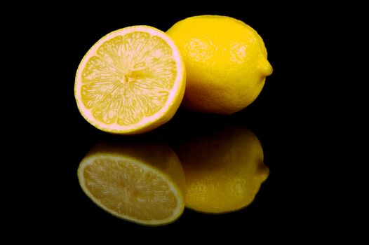 Lemon citrus fruits isolated against a black background