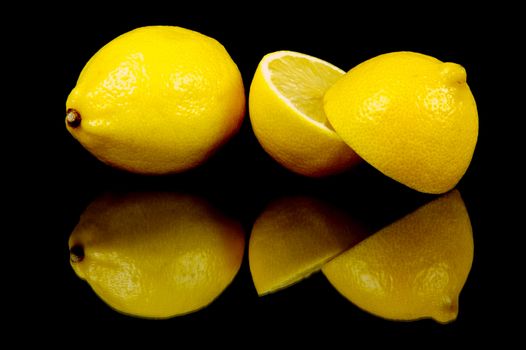 Lemon citrus fruits isolated against a black background