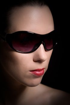 Classic portrait of brunette with sunglasses