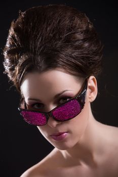 Woman with stylish hair and pink sunglasses