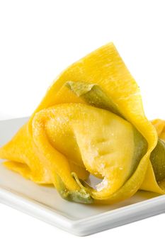 single tortelloni noodle on a white plate