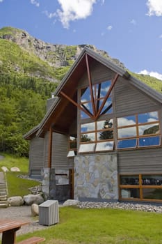 a modern chalet in the middle of the mountains