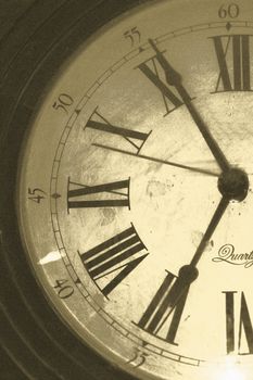 Grunge clock in sepia tones