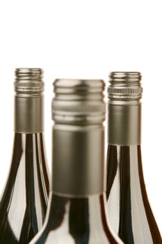 Bottles of red wine isolated against a white background