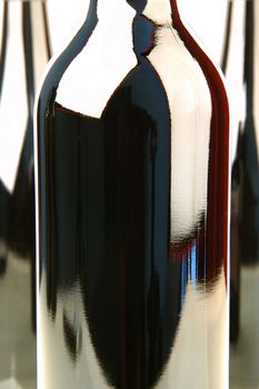 Bottles of red wine isolated against a white background