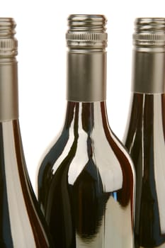 Bottles of red wine isolated against a white background
