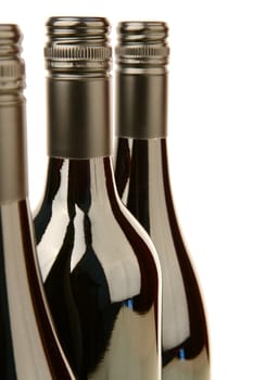 Bottles of red wine isolated against a white background