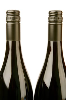 Bottles of red wine isolated against a white background