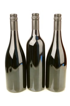 Bottles of red wine isolated against a white background