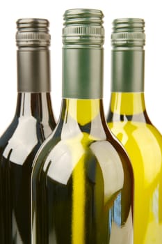 Bottles of red and white wine isolated against a white background