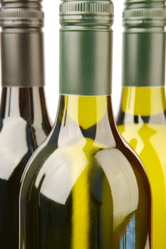Bottles of red and white wine isolated against a white background
