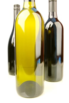 Bottles of red and white wine isolated against a white background