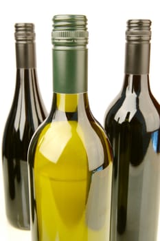 Bottles of red and white wine isolated against a white background