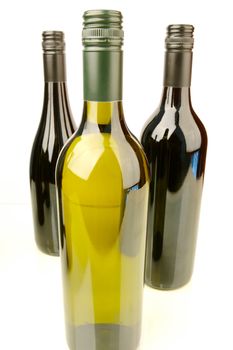 Bottles of red and white wine isolated against a white background