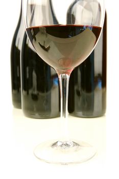 Red and white wine isolated against a white background