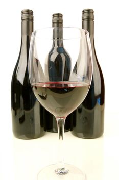 Red and white wine isolated against a white background