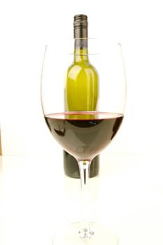 Red and white wine isolated against a white background