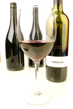 Red and white wine isolated against a white background