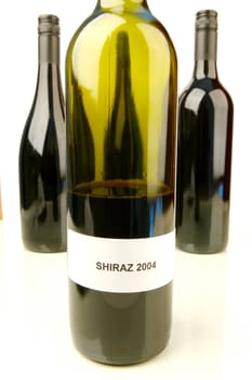 Red and white wine isolated against a white background
