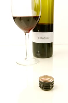 Red and white wine isolated against a white background